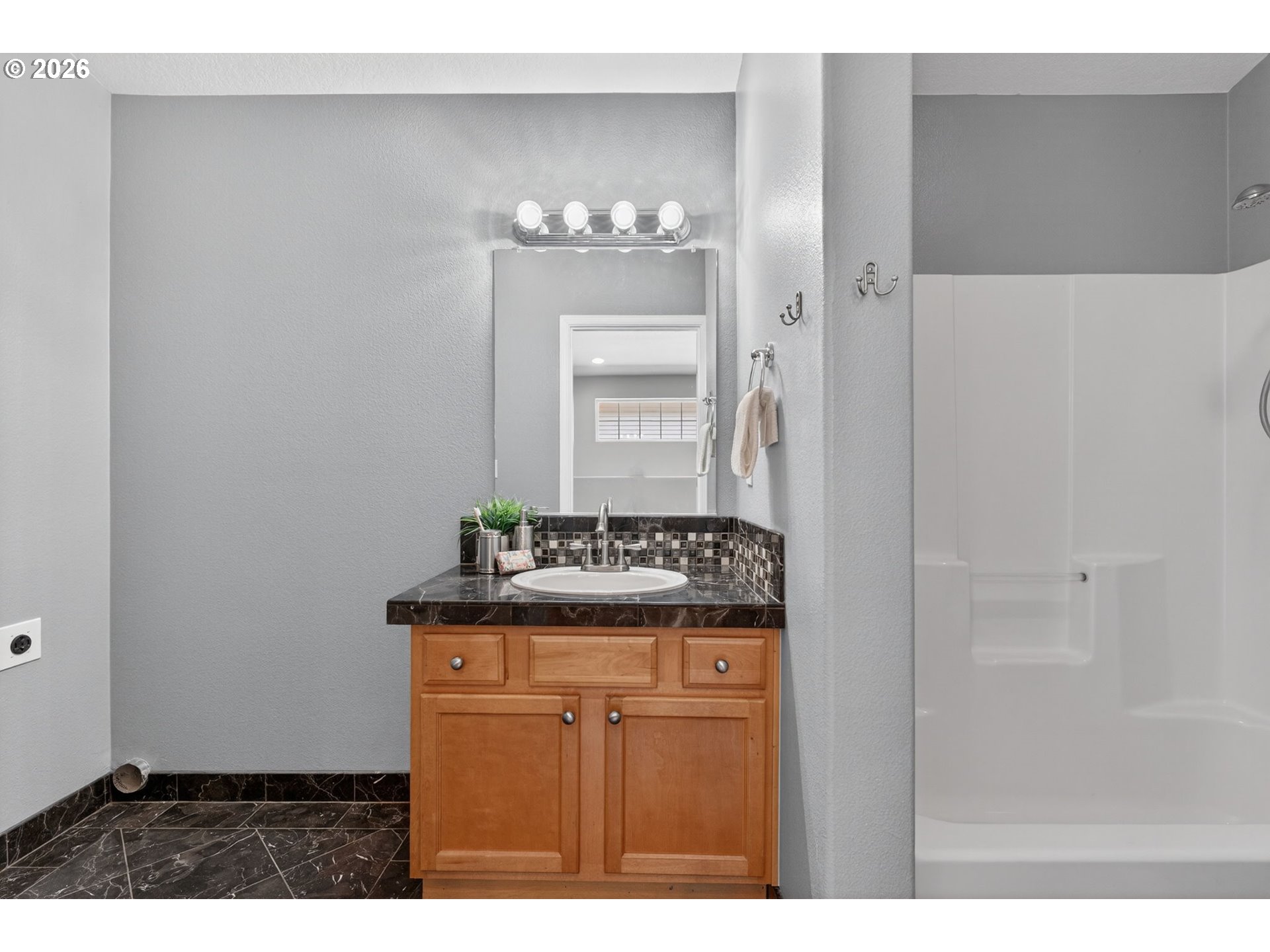 12619 Southeast Foster Road Portland, OR 97236 - Photo 31 of 48 a bathroom with a sink and a mirror