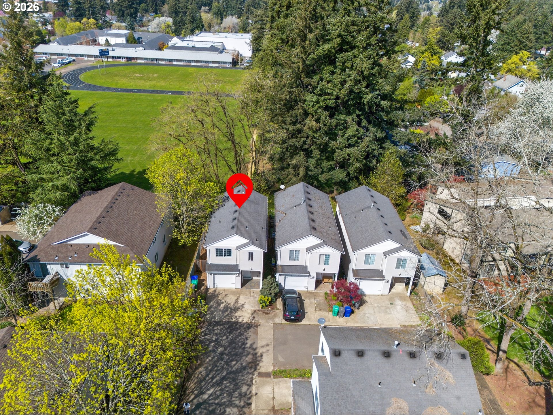 12619 Southeast Foster Road Portland, OR 97236 - Photo 45 of 48 an aerial view of a house with swimming pool and lake view