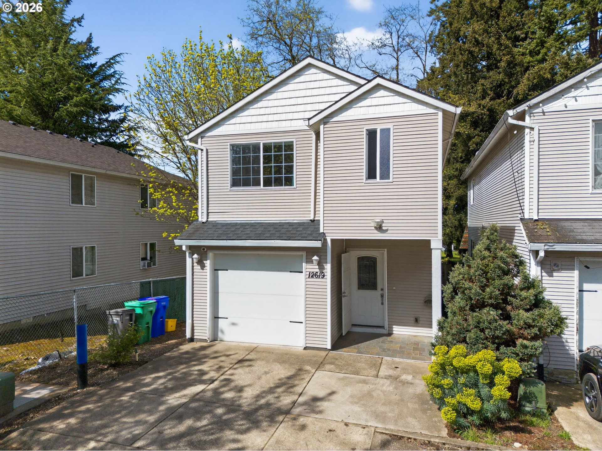 12619 Southeast Foster Road Portland, OR 97236 - Photo 47 of 48 a view of a house with a yard and potted plants