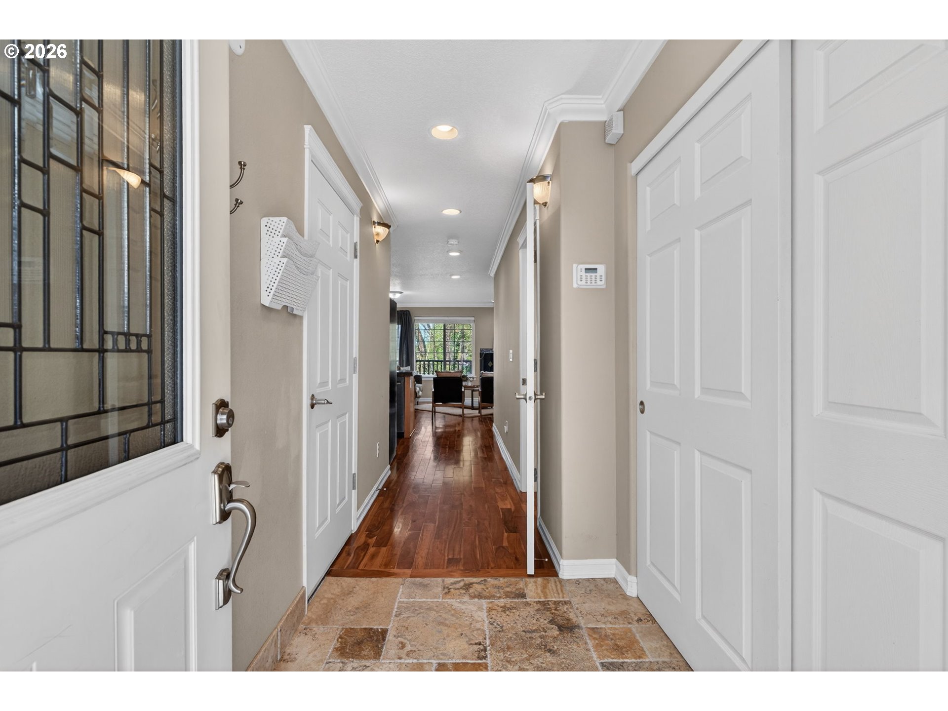 12619 Southeast Foster Road Portland, OR 97236 - Photo 6 of 48 a view of a hallway with wooden floor and a living room