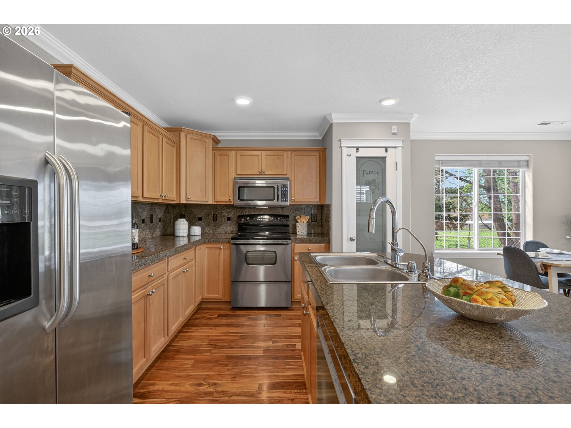 12619 Southeast Foster Road Portland, OR 97236 - Photo 9 of 48 a kitchen with sink refrigerator and stove