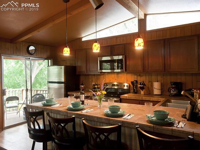 1539 West Cheyenne Road Colorado Springs, CO 80906 - Photo 3 of 29 Upper bungalow kitchen