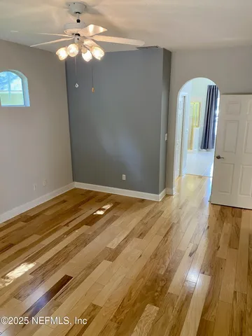 a view of a livingroom with wooden floor