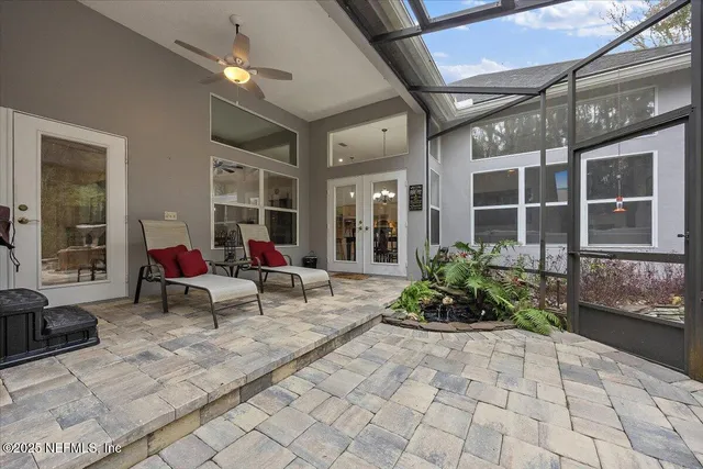 a man sitting on a bench in front of a building