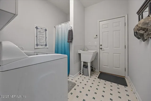 a room with a chair and a refrigerator