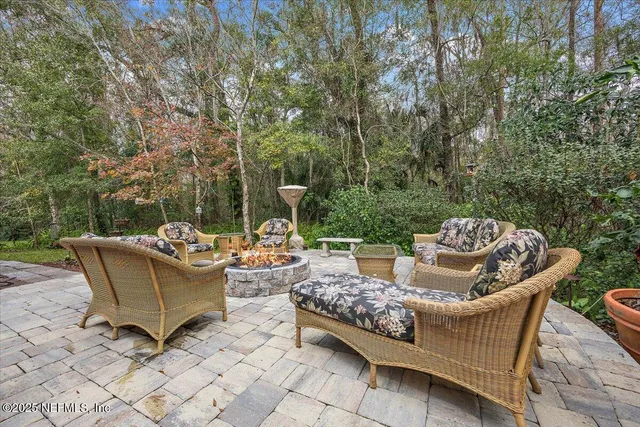 a view of a patio with couches and a table and chairs