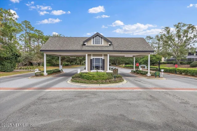 a view of house with outdoor space and parking