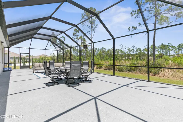 a view of a yard with palm trees