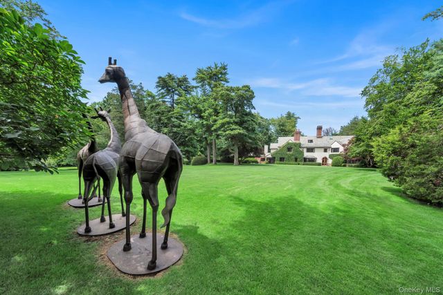 a view of a fountain in the front of the house