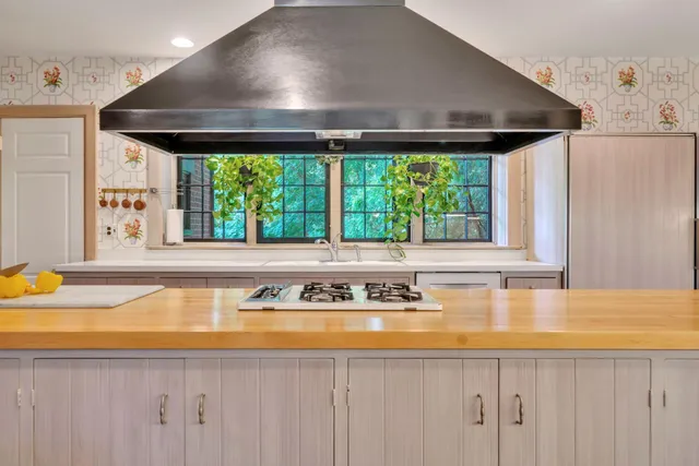 a utility room with lots of appliances and cabinets