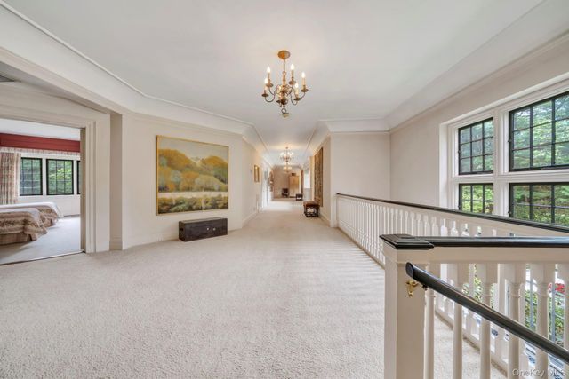 a view of hall way with furniture