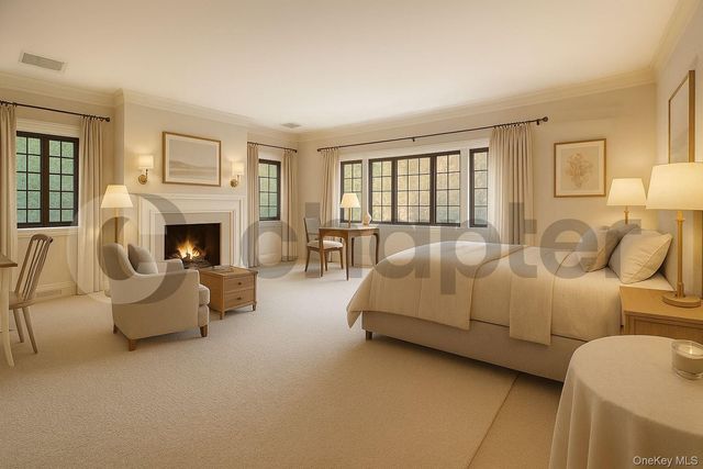 a living room with furniture fireplace and a large window