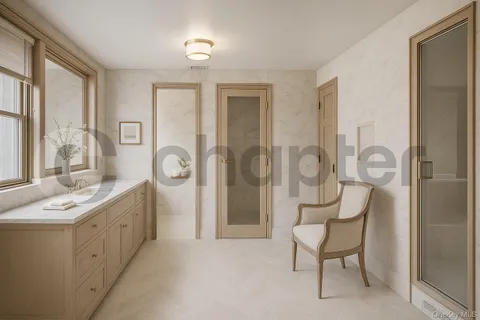 a spacious bathroom with a mirror a sink and a shower