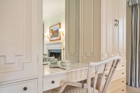 a view of living room with furniture and fireplace