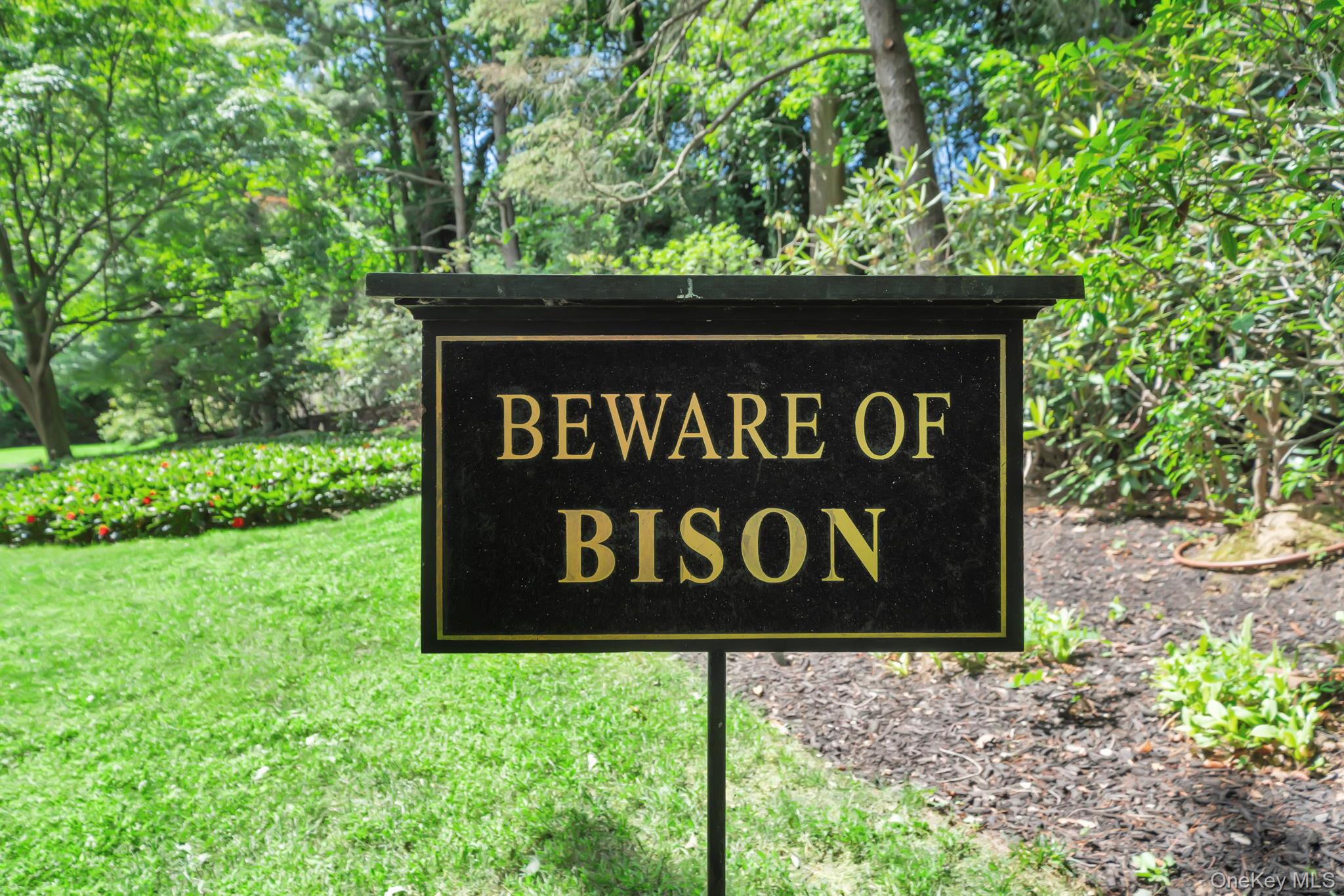 95 Piping Rock Road Locust Valley, NY 11560 - Photo 4 of 42 a sign that is sitting on a brick wall