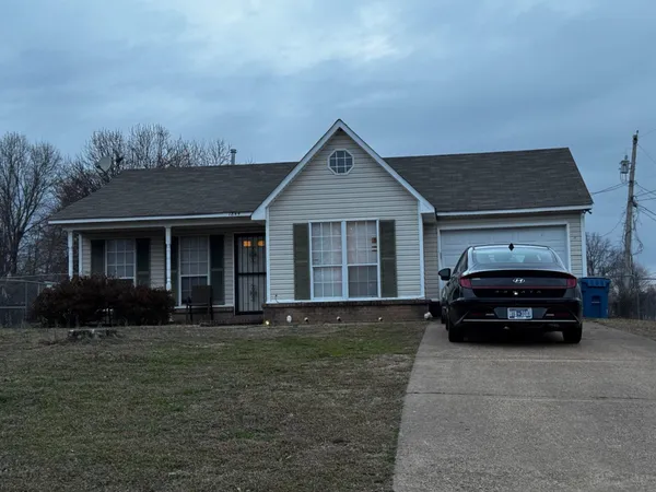 a car parked in front of a house