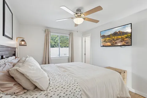 a bedroom with a bed and a window