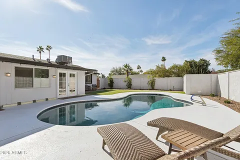 a view of a swimming pool with a patio