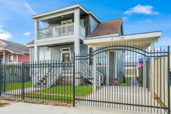 a view of a house with a iron gate