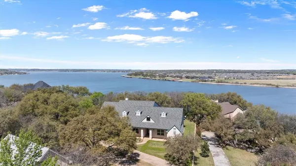 an aerial view of a house with a garden