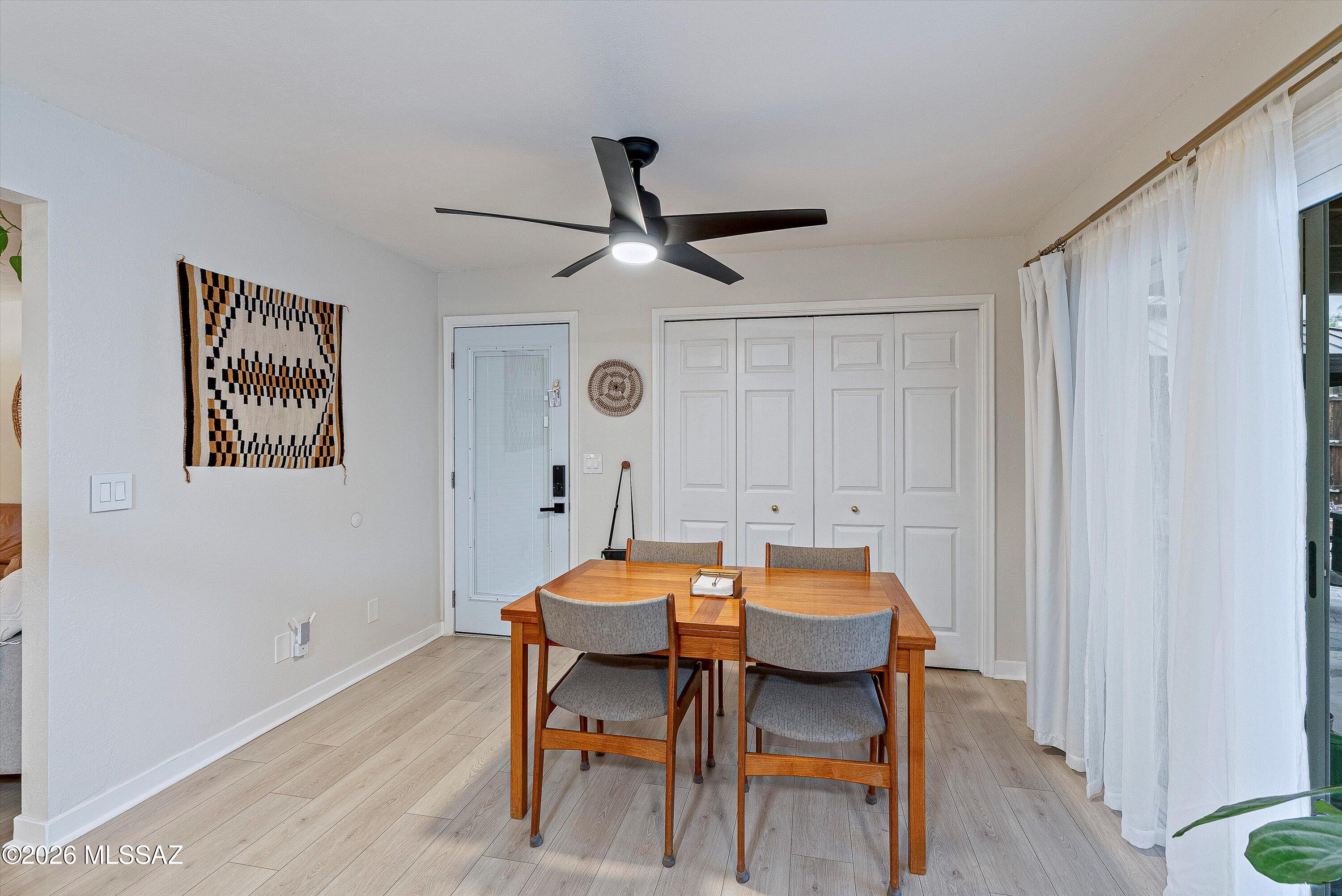 3949 West Mars Street Tucson, AZ 85741 - Photo 24 of 27 a dining room with furniture and a window