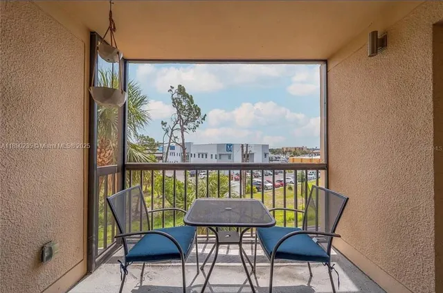 a view of a balcony with chairs