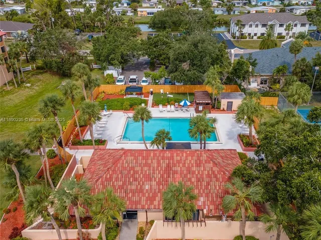 an aerial view of a houses with outdoor space