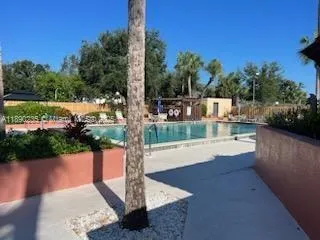 a view of a chairs and table in backyard