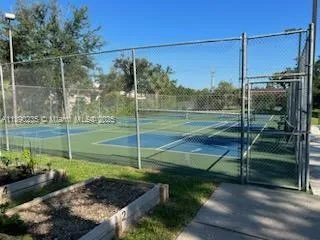a view of a park with large trees