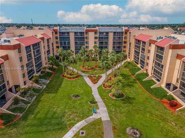 a view of swimming pool and outdoor seating