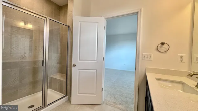 a bathroom with a tub and shower