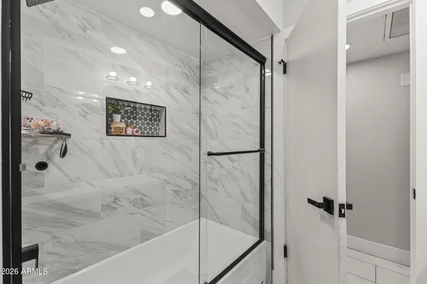 a bathroom with a double vanity sink and a mirror