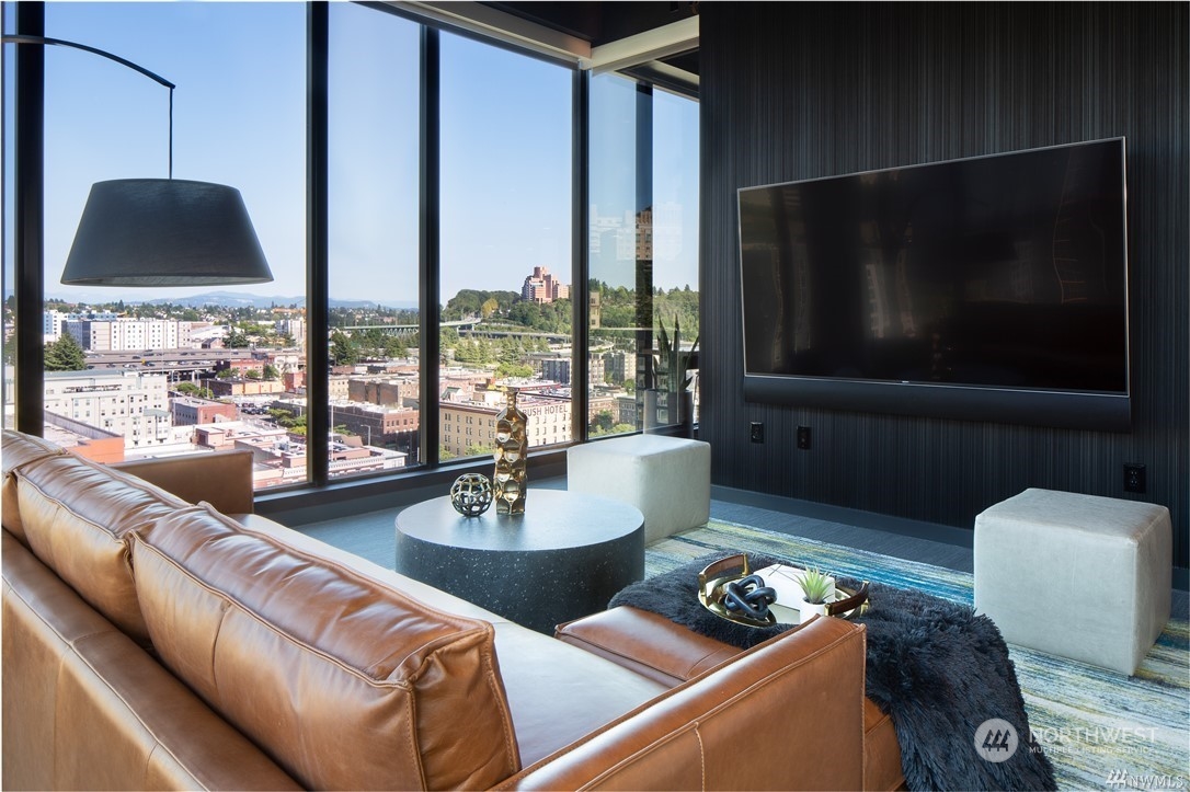 450 South Main Street, Unit 1110 Seattle, WA 98104 - Photo 20 of 24 a living room with furniture and a flat screen tv