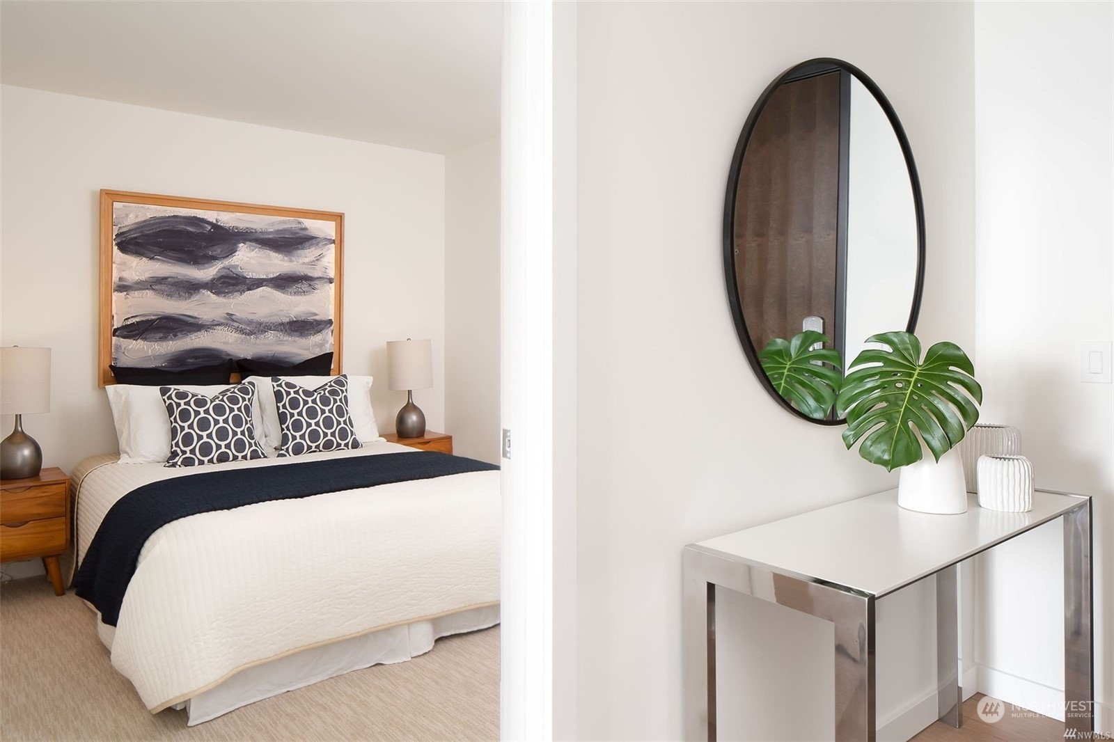 450 South Main Street, Unit 1110 Seattle, WA 98104 - Photo 8 of 24 a bedroom with a bed and a potted plant