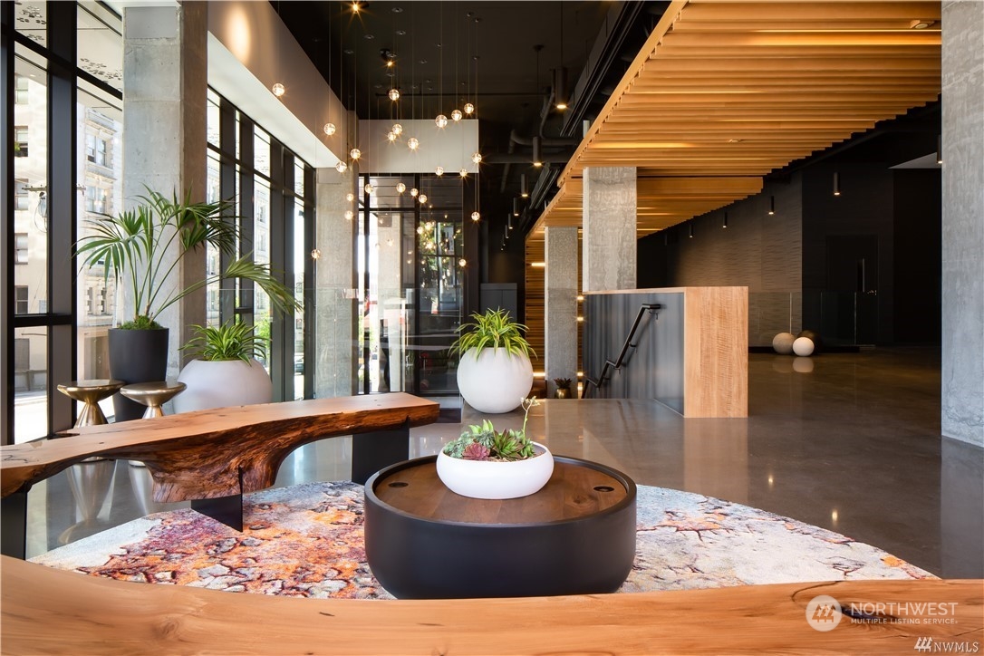 450 South Main Street, Unit 1110 Seattle, WA 98104 - Photo 10 of 24 a living room with furniture and a fireplace
