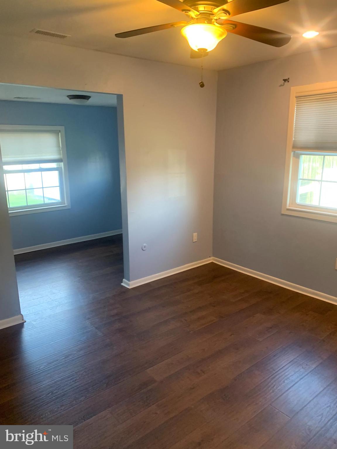956 North Beecham Road Williamstown, NJ 08094 - Photo 11 of 17 an empty room with wooden floor and windows