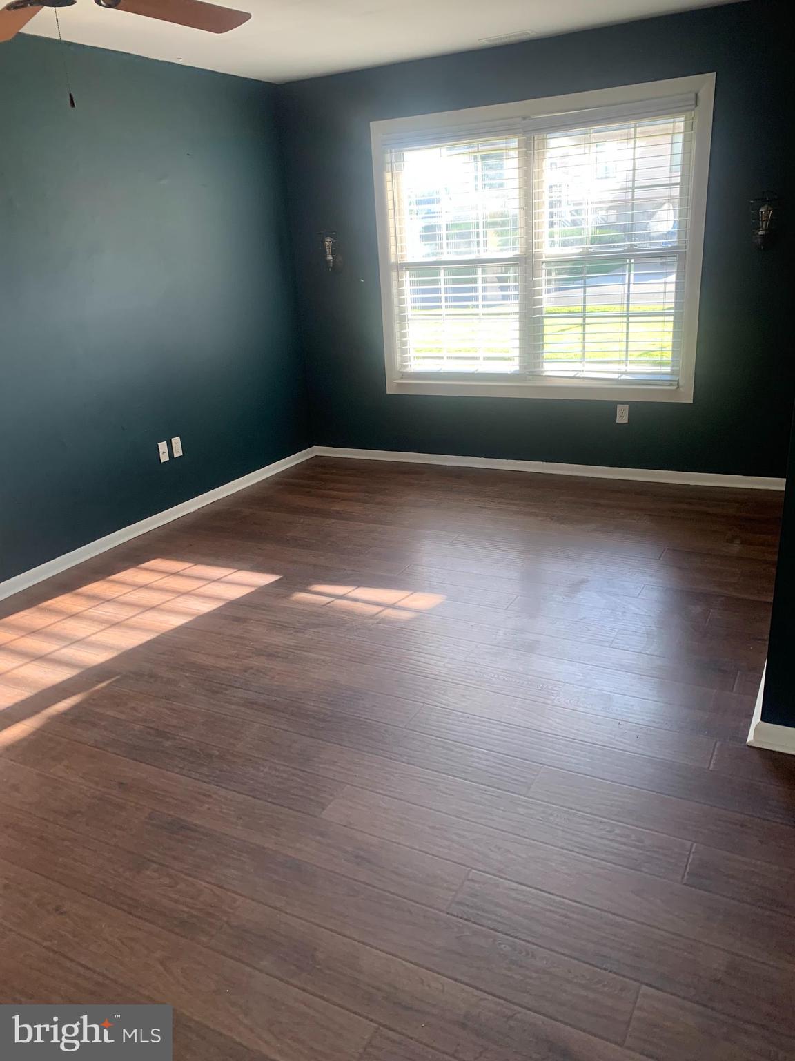 956 North Beecham Road Williamstown, NJ 08094 - Photo 15 of 17 a view of empty room with wooden floor and fan