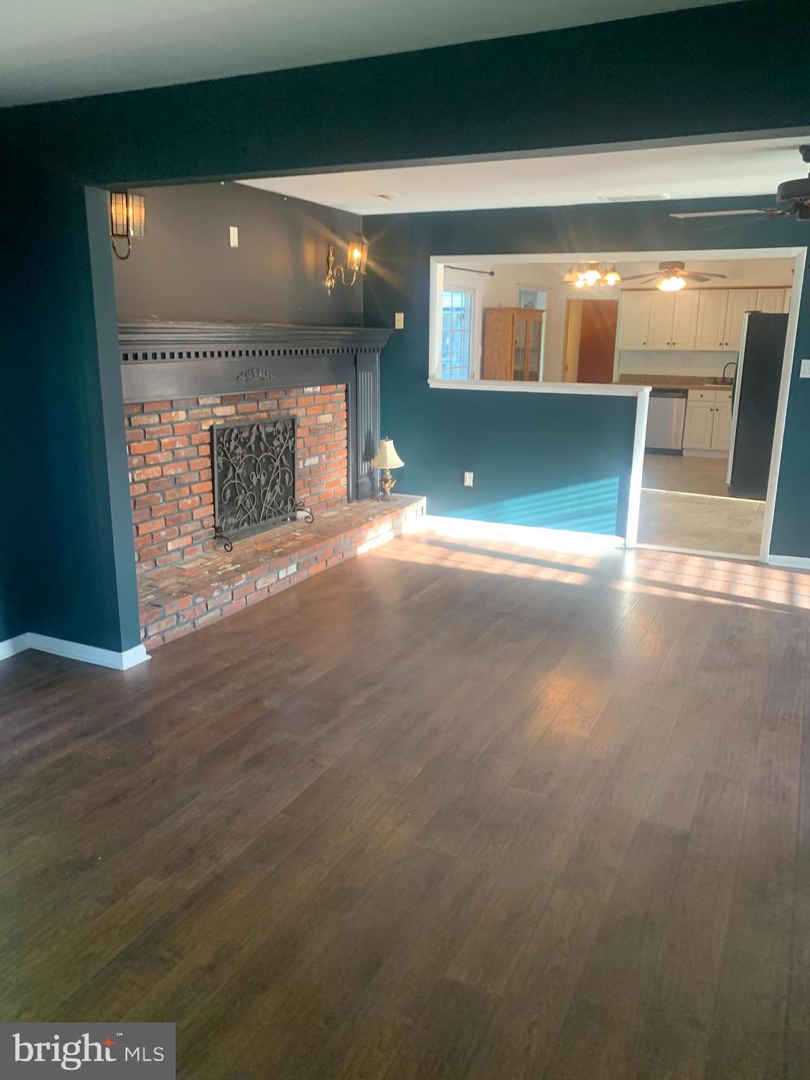 956 North Beecham Road Williamstown, NJ 08094 - Photo 17 of 17 a view of empty room with wooden floor and fireplace