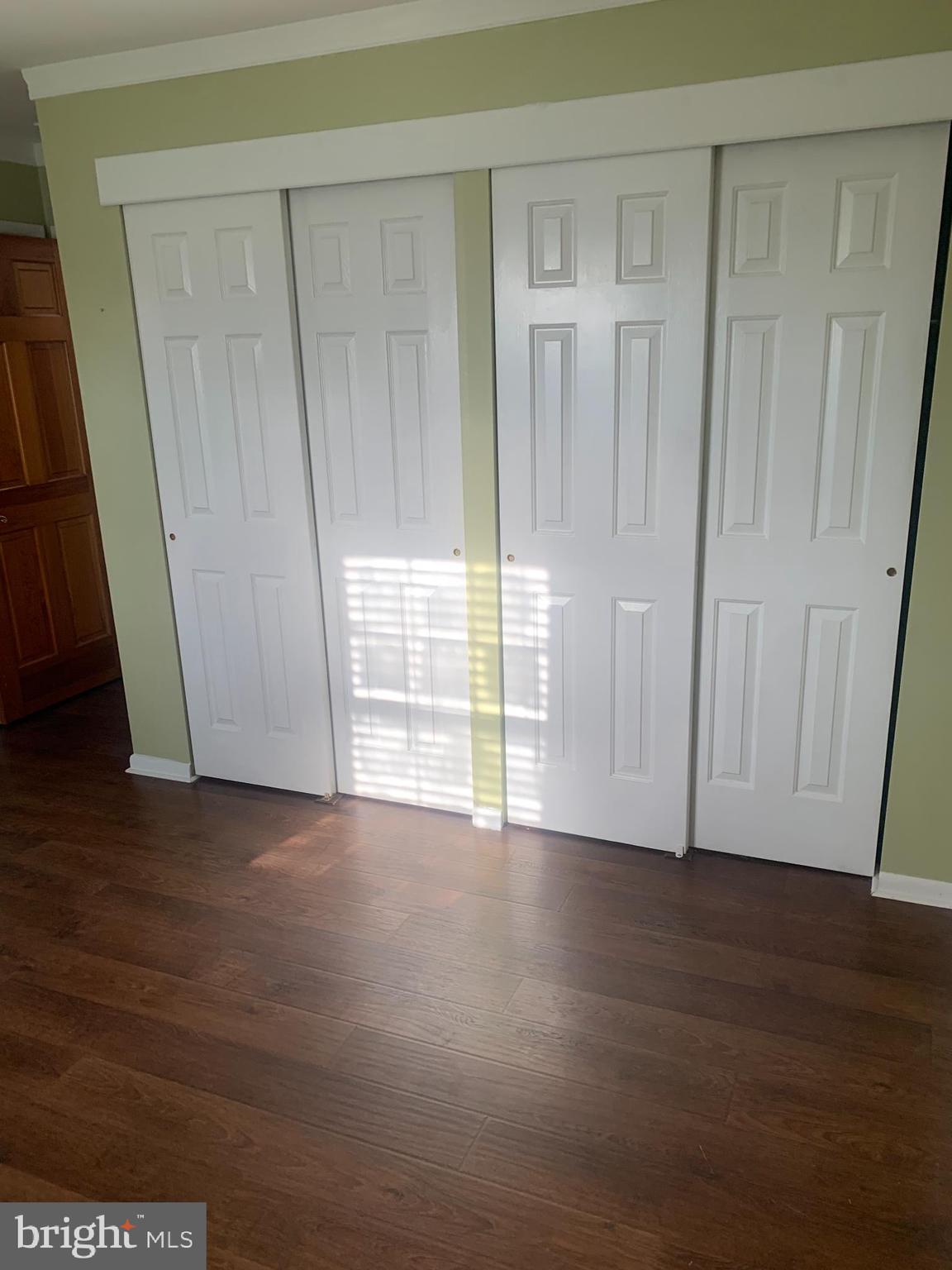 956 North Beecham Road Williamstown, NJ 08094 - Photo 4 of 17 a view of an empty room with wooden floor