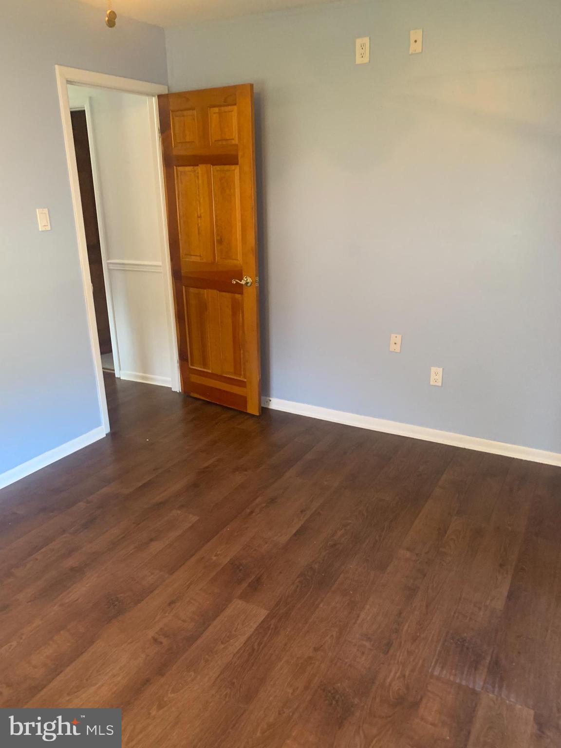 956 North Beecham Road Williamstown, NJ 08094 - Photo 9 of 17 an empty room with wooden floor and entrance