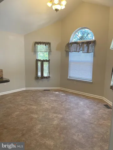 en empty room with windows