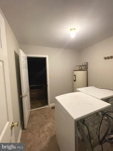 a room with a table and chairs