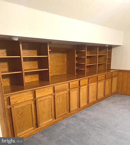 a bathroom with a sink toilet and mirror