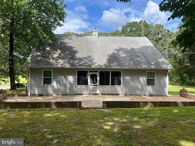a front view of house with yard space and balcony