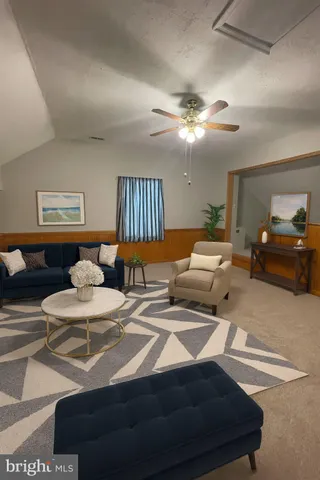 a bedroom with two beds and a chandelier