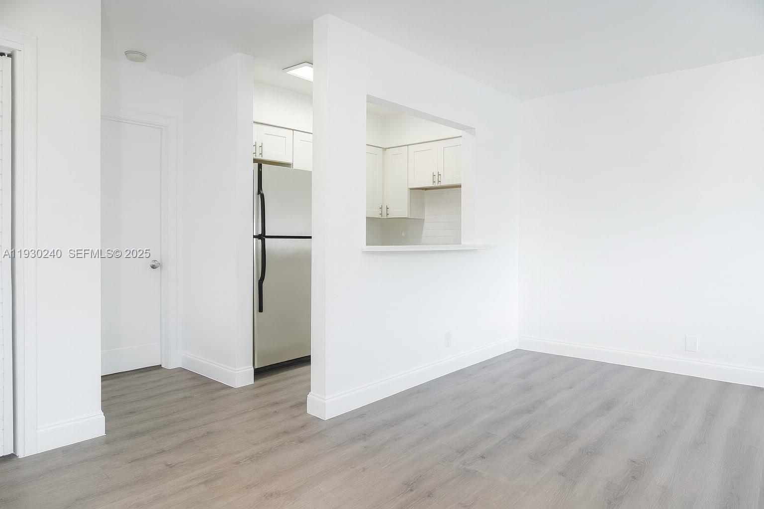 749 Southeast 15th Street, Unit 8 Fort Lauderdale, FL 33316 - Photo 4 of 15 a view of a room with wooden floor and a bathroom