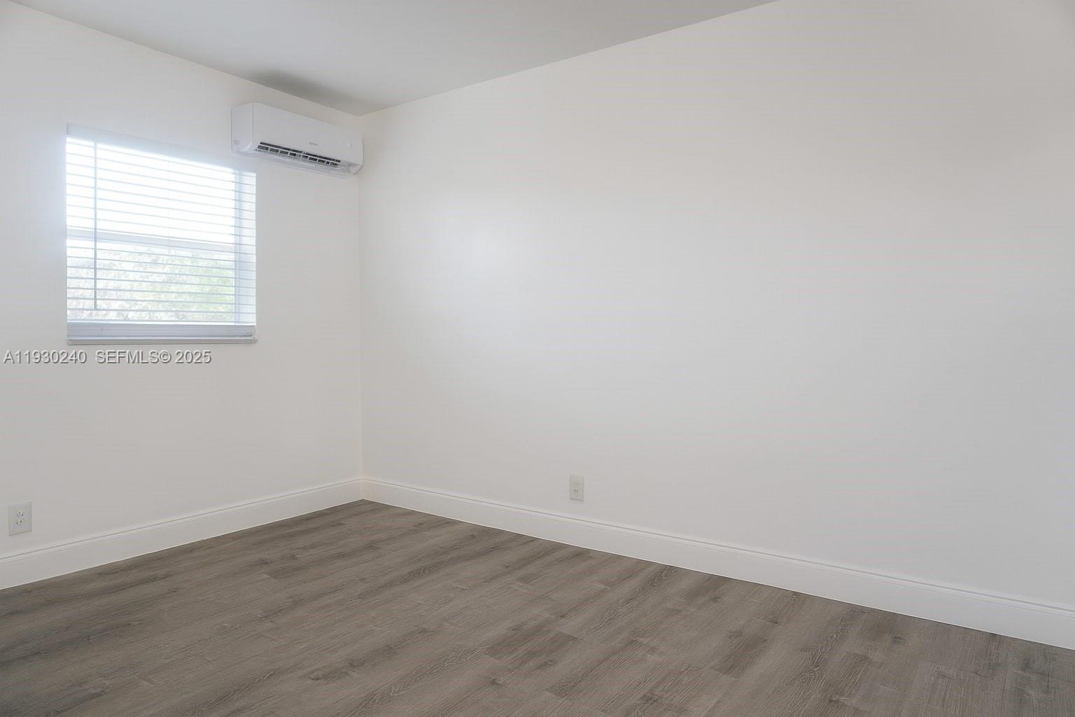 749 Southeast 15th Street, Unit 8 Fort Lauderdale, FL 33316 - Photo 8 of 15 wooden floor in an empty room with a window