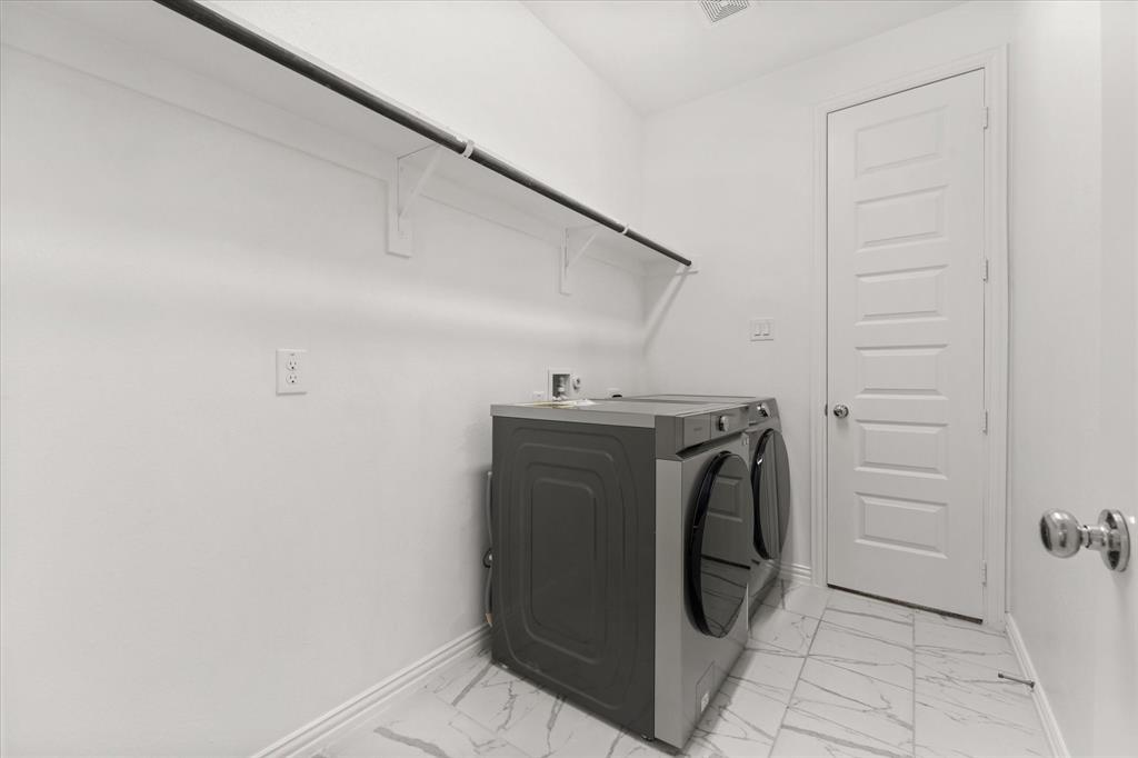 3533 Hyacinth Way Prosper, TX 75078 - Photo 9 of 38 a utility room with dryer and washer