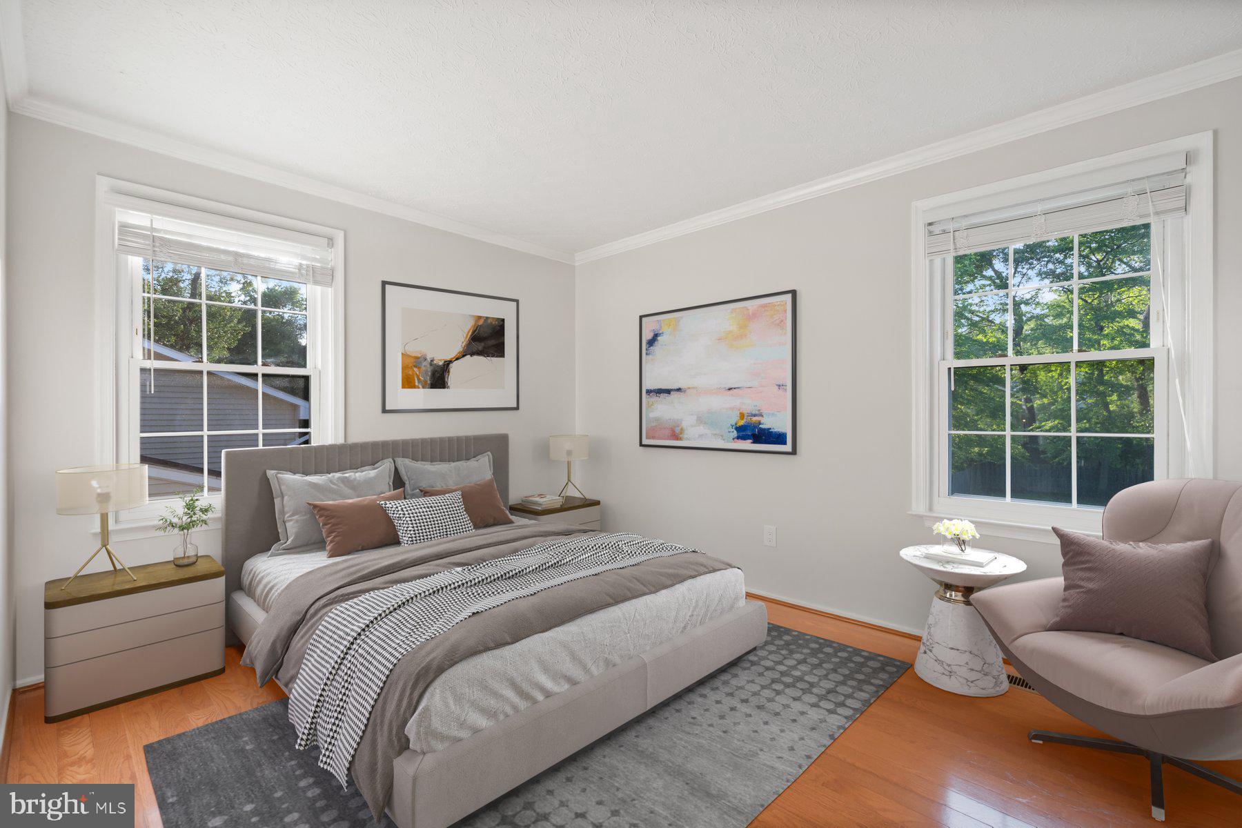 8304 Grainfield Road Severn, MD 21144 - Photo 11 of 49 a bedroom with a large bed couch and window