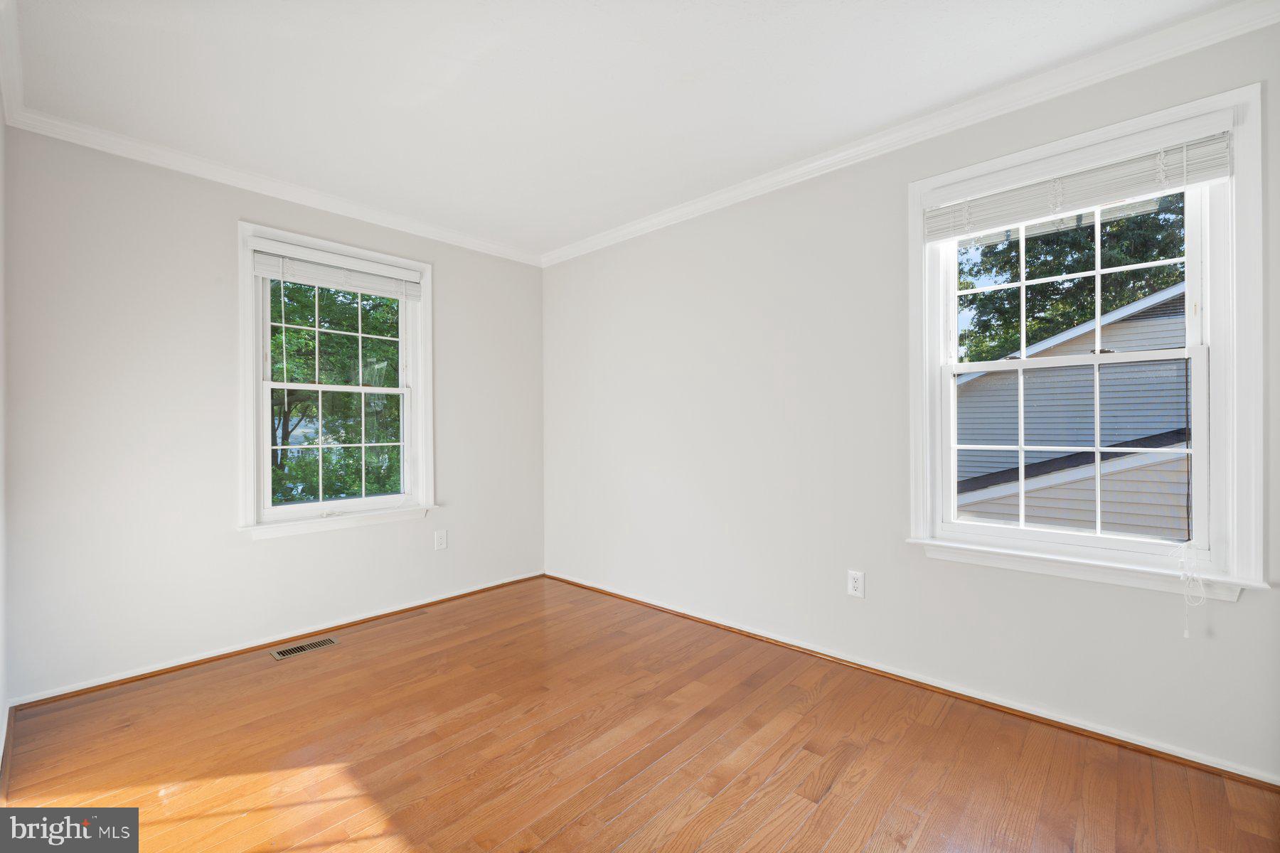 8304 Grainfield Road Severn, MD 21144 - Photo 13 of 49 a view of an empty room with a window